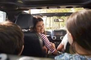 Mom driving her kids this summer