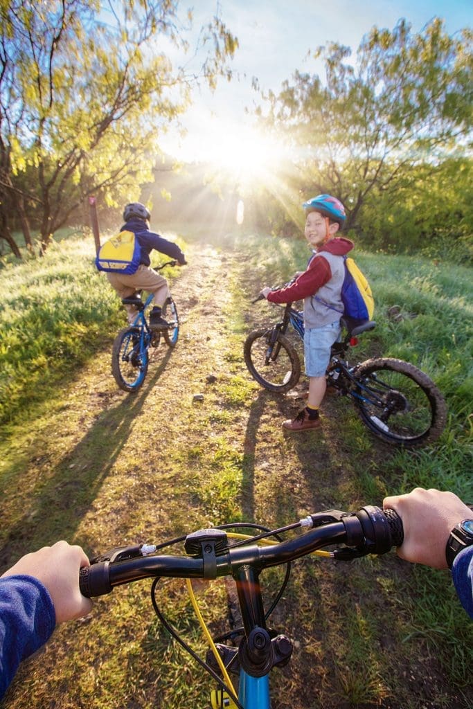 What Scouting Means - boys riding bikes in the sun