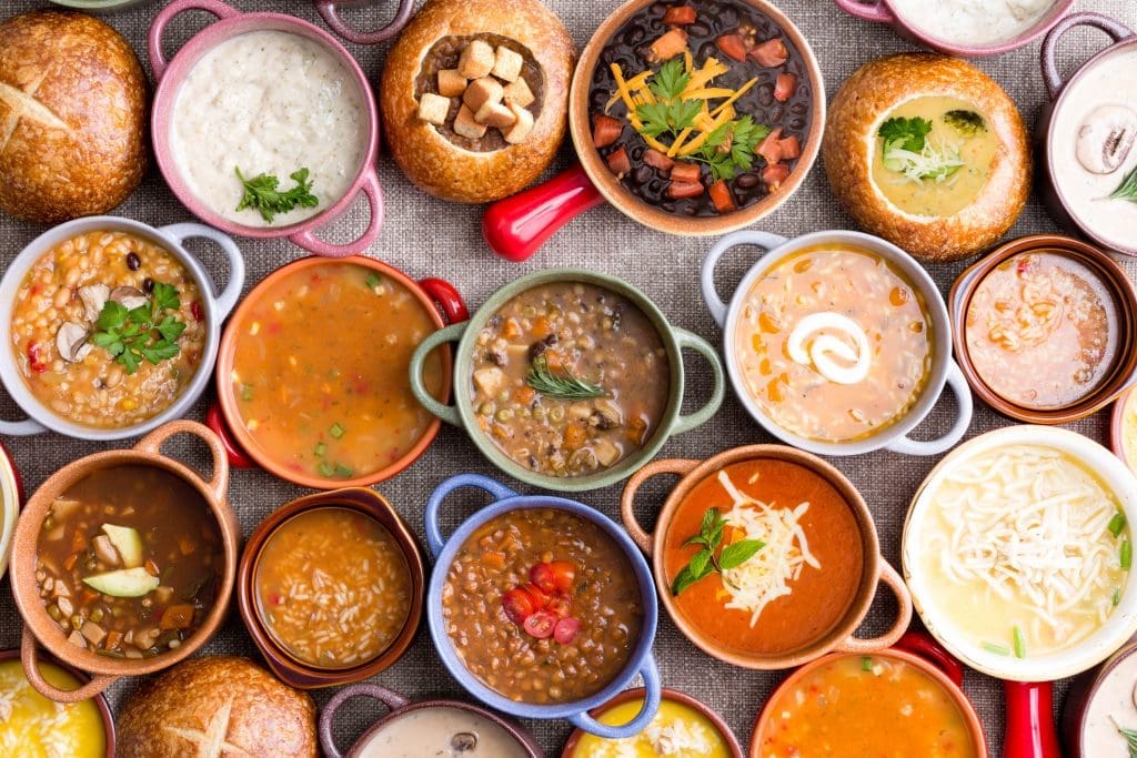 10 Reasons to Eat More Soup. High angle of various bowls of soup