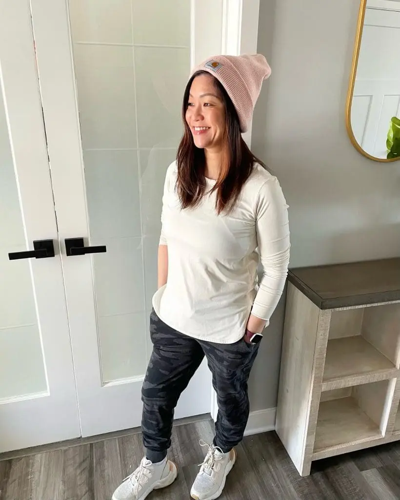 Asian woman standing in athleisure outfit. Is athleisure the new black?