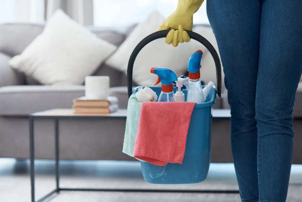spring cleaning check list-2022 Shot of an unrecognizable woman holding a bucket of cleaning detergent before mopping her floors at home