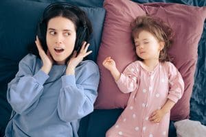 Mom babysitting during daytime nap listening to music - best audiobooks for busy moms