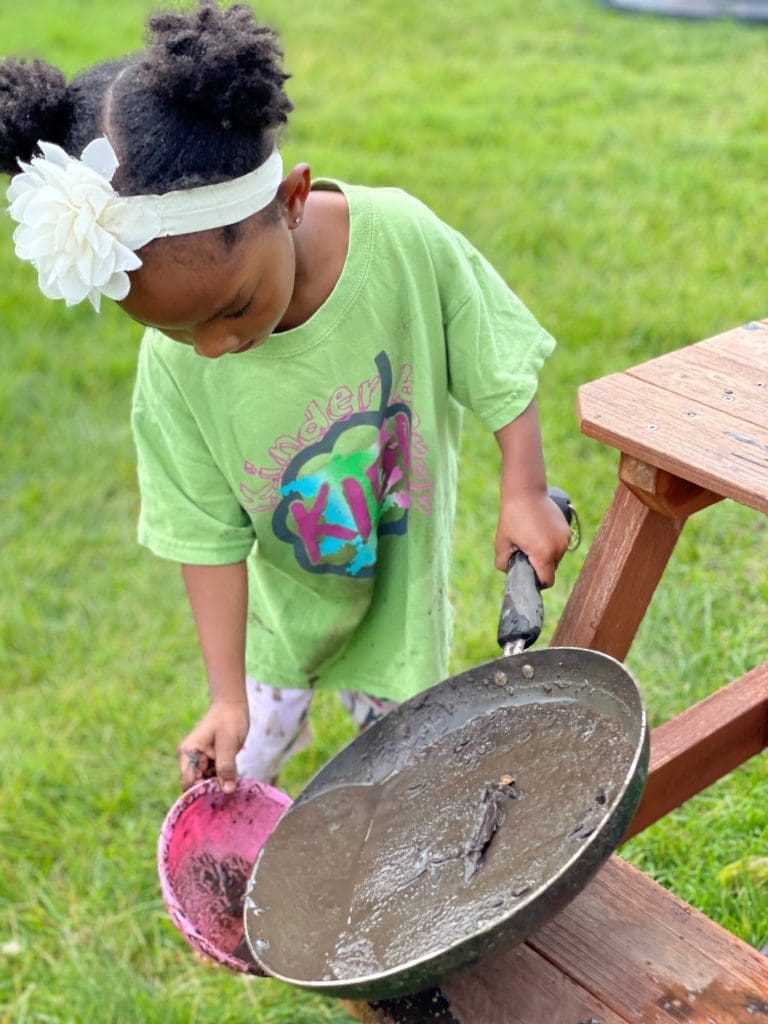 child playing with mud